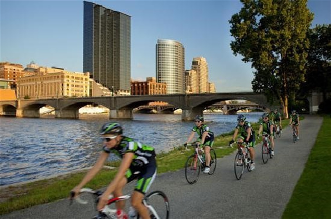 photo of bikers riding on an off street trail