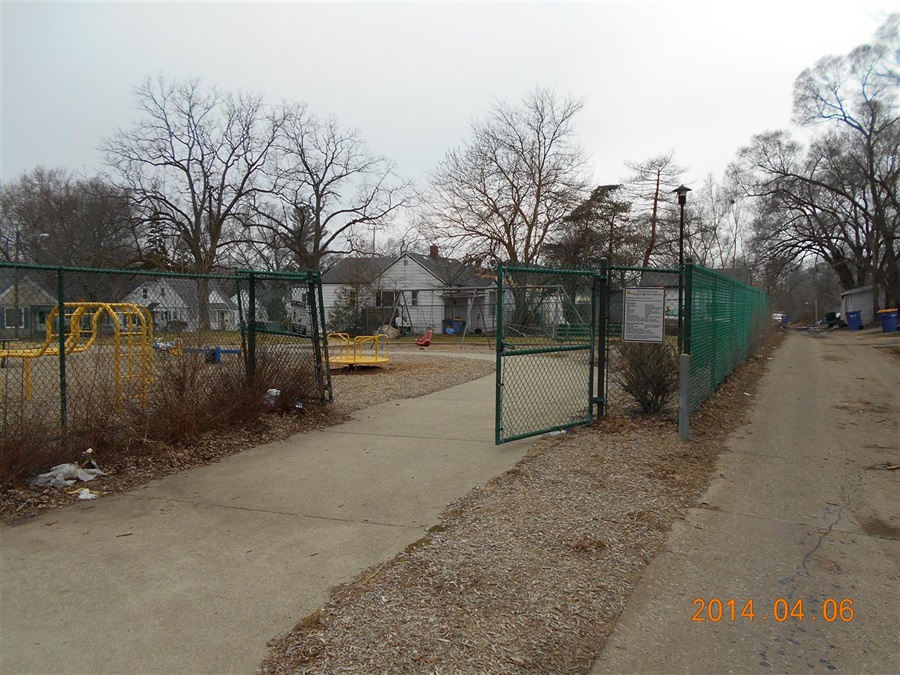 Playground area surrounded by chain link fencing
