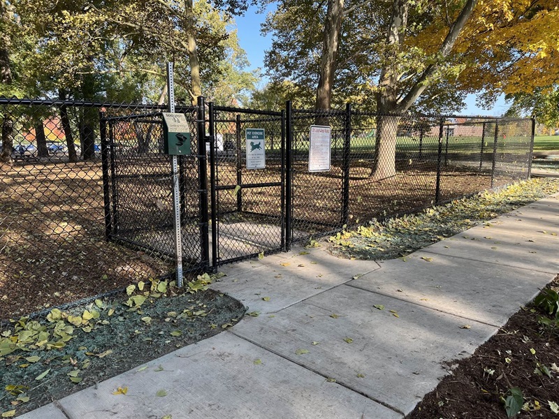 Dog park entrance with double gate.