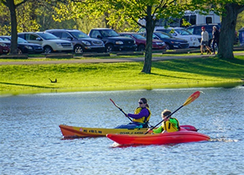 Residents using kayaks at a recent Family Paddle Night