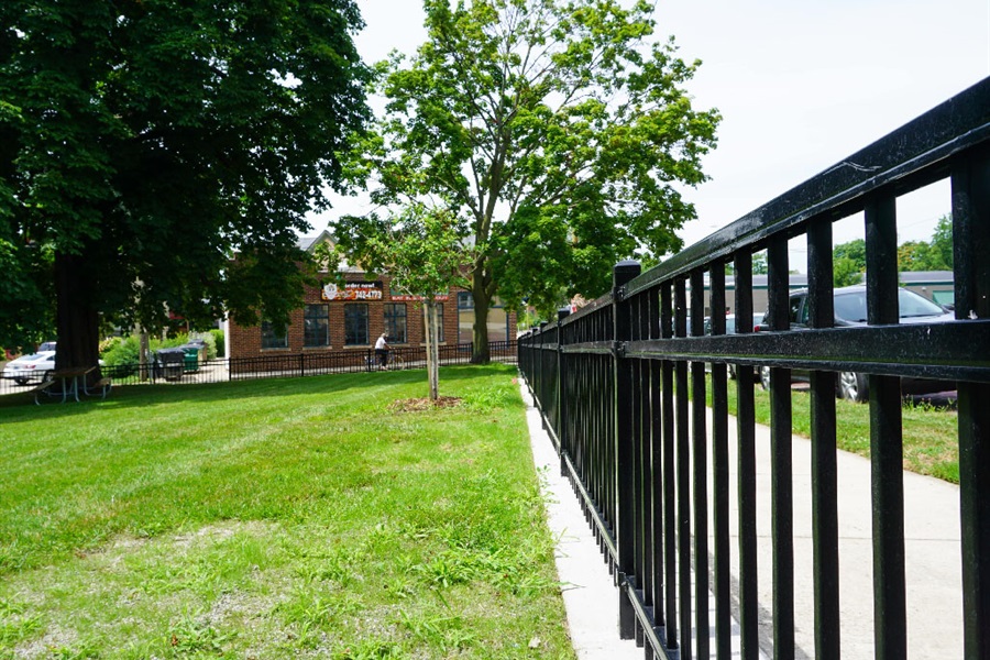 Fence and green space at Foster Park