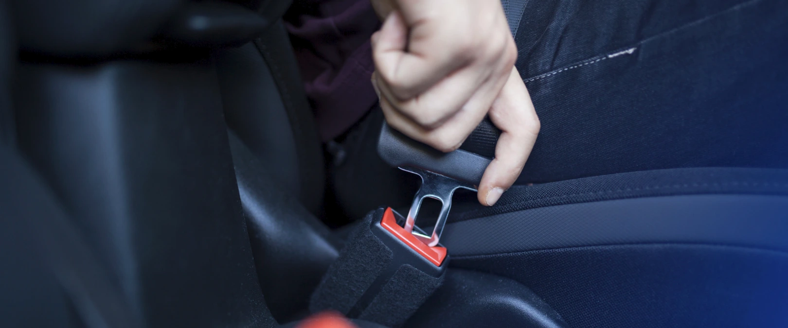 photo of putting on a seatbelt