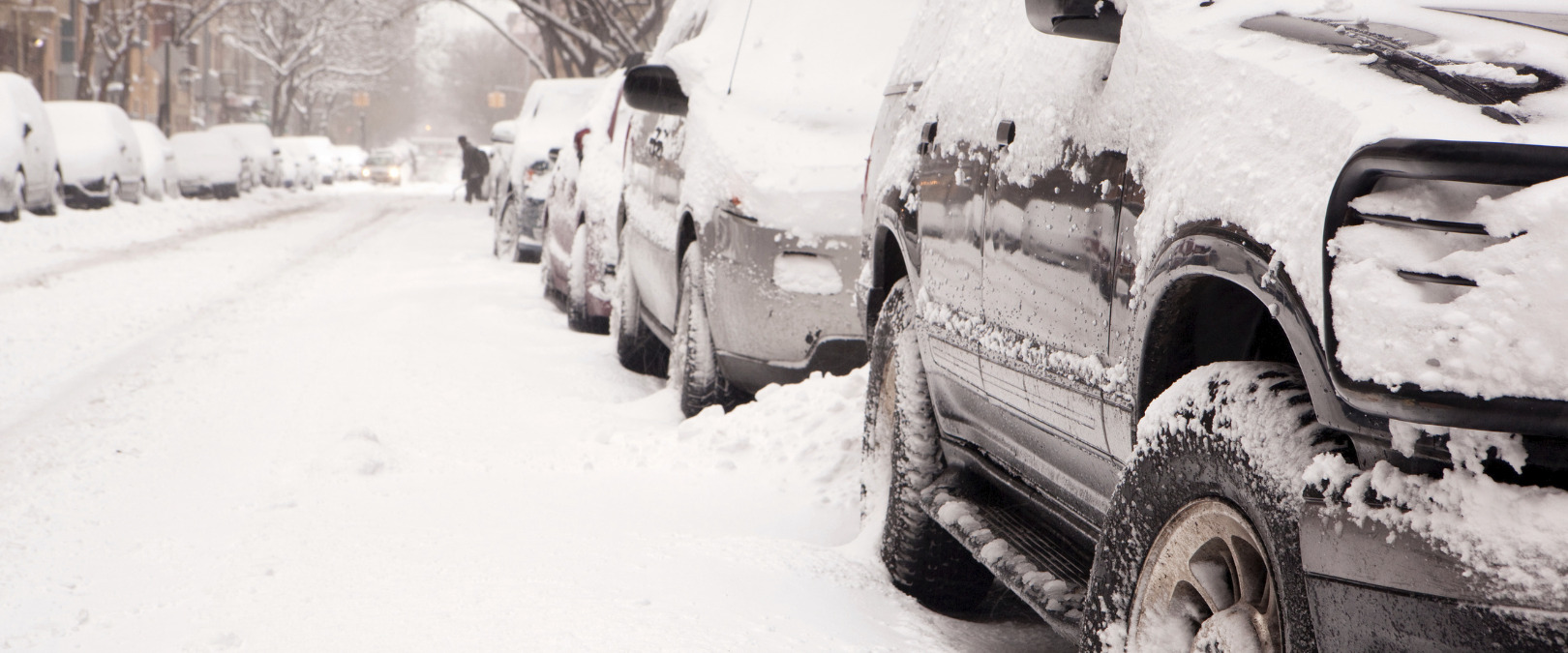 snowy street with cars